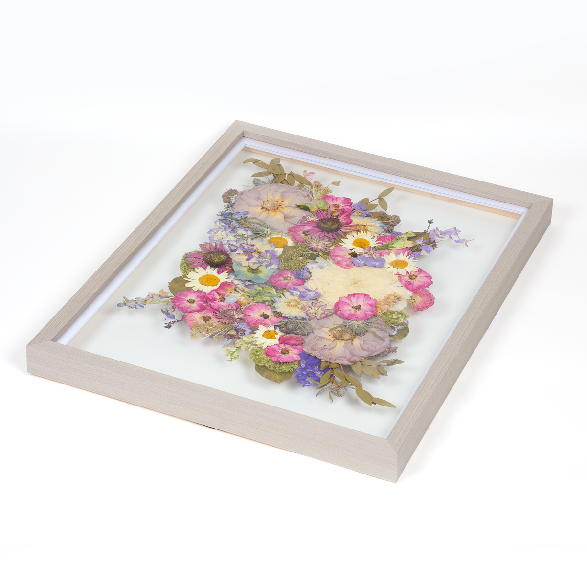Floral preservation pressed flower frame with bright pink, purple, and blue pressed florals. 16x20 gray wood frame bridal bouquet preservation design.