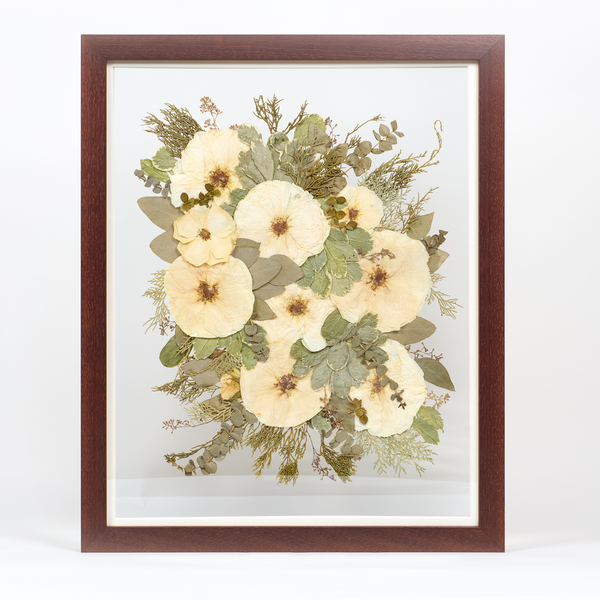 Floral preservation pressed flower frame with white and green pressed florals. 16x20 walnut wood frame bridal bouquet preservation design.