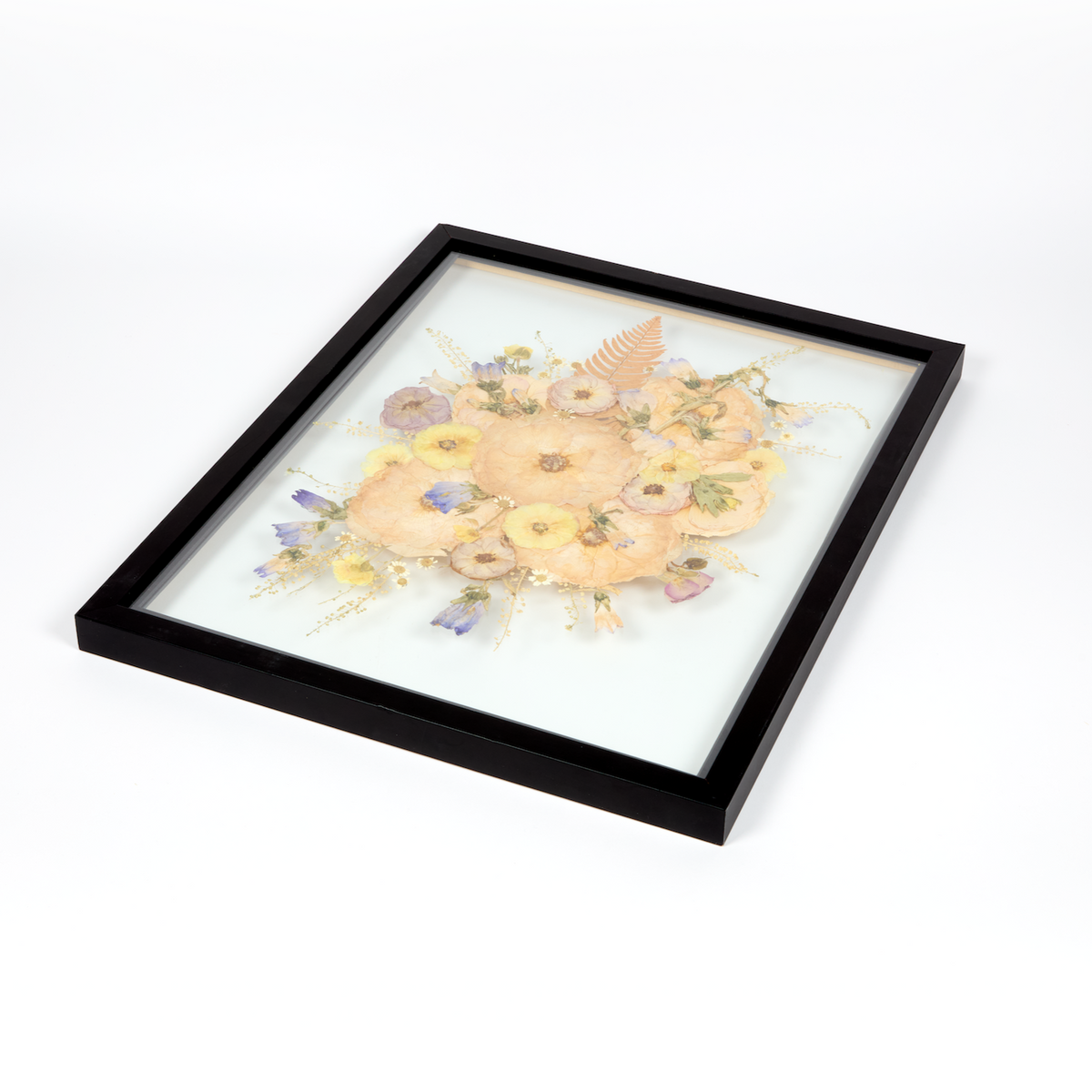 Floral preservation pressed flower frame with white, pink, and purple pressed florals. 16x20 black wood frame design.