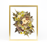 Floral preservation pressed flower frame with white, green, and red pressed florals. 16x20 gold wood frame design.