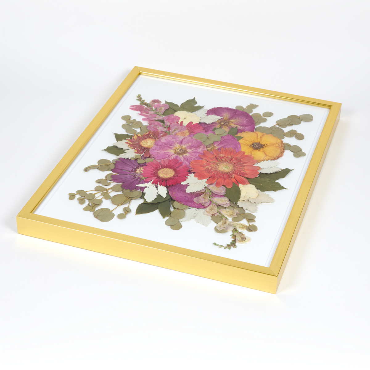 Floral preservation pressed flower frame with bright pink, red, and yellow pressed florals. 16x20 gold wood frame design.