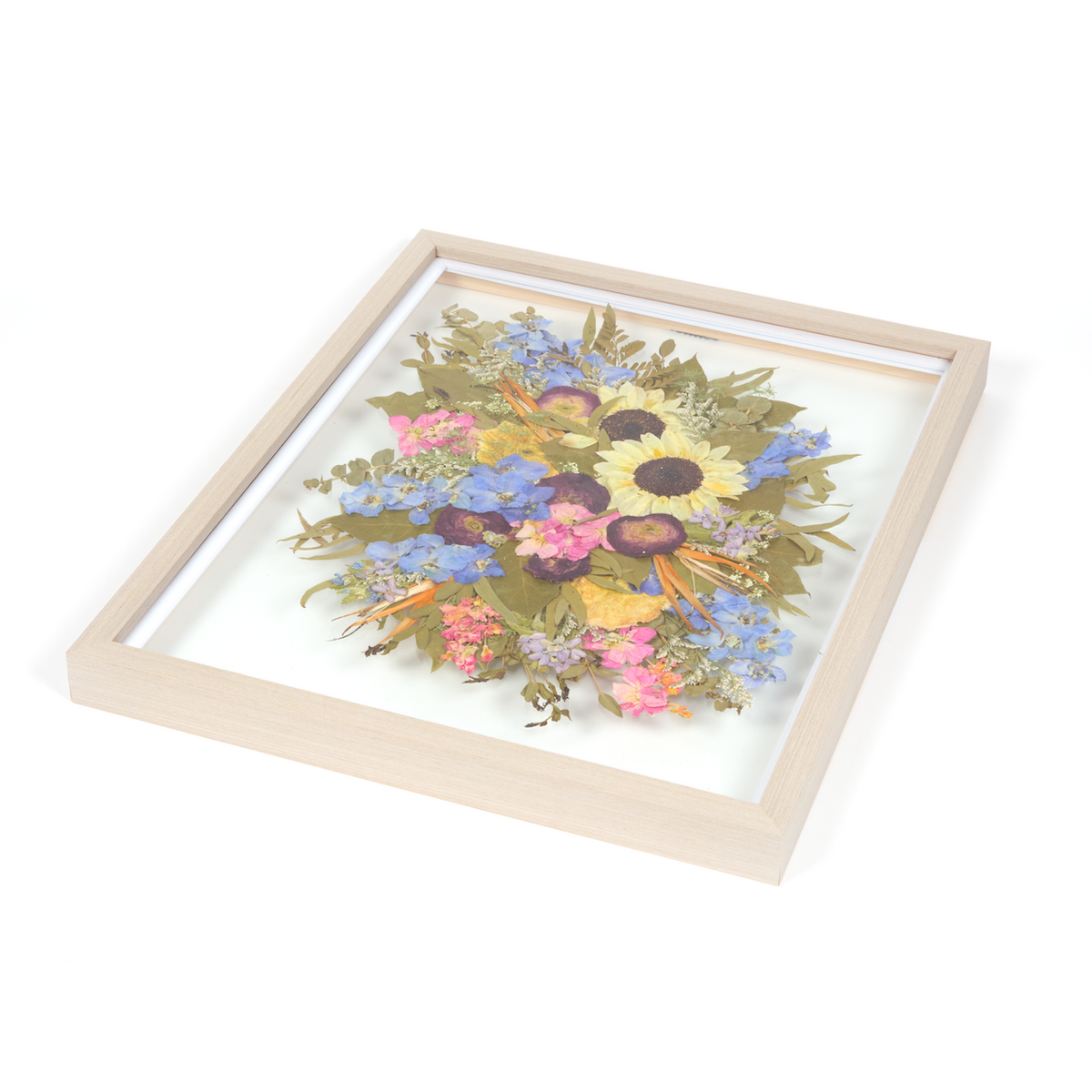 Floral preservation pressed flower frame with pressed sunflowers, pressed birds of paradise, pressed ranunculus, and more pressed florals. 16x20 gray wood frame bridal bouquet preservation design.