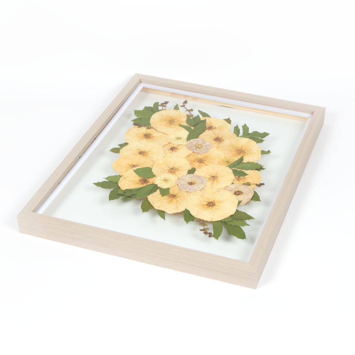 Floral preservation pressed flower frame with white, green, and pink pressed florals. 16x20 gray wood frame bridal bouquet preservation design.