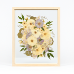 Bridal bouquet preservation in a 16x20 natural wood frame. White and purple pressed florals with greenery accents fill the frame with a floating glass background.