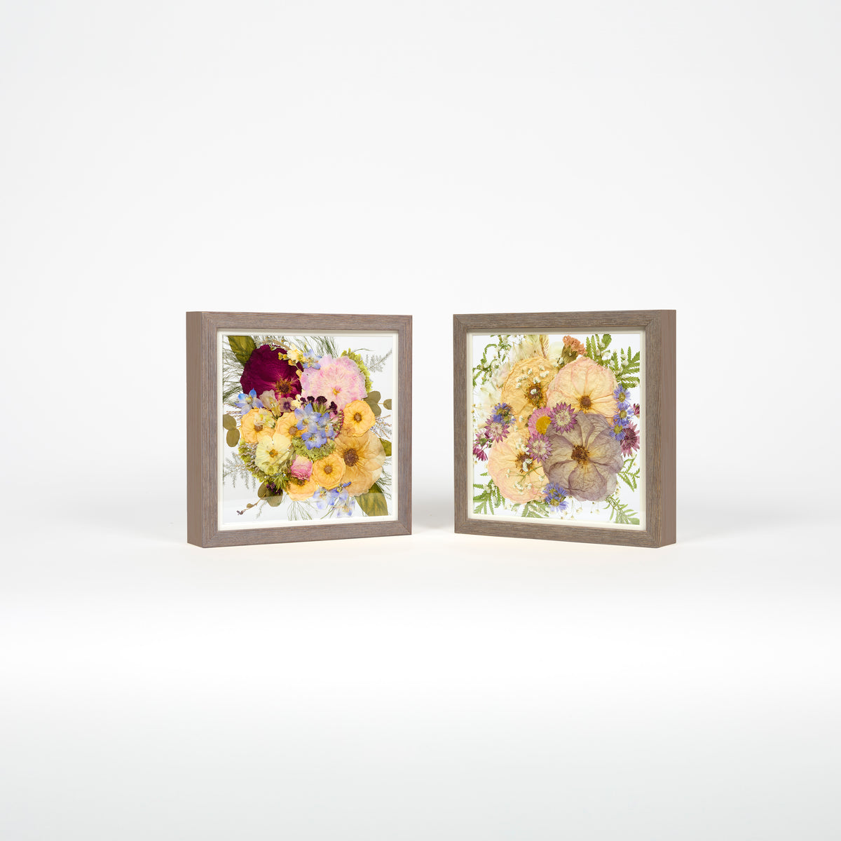 Pressed flower wedding preservation with two 10x10 inch frame bundle offering in barn wood.