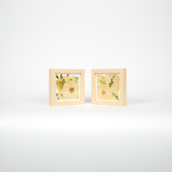A double order of two 6x6 frames with all white florals and greenery to be gifted or displayed side by side.