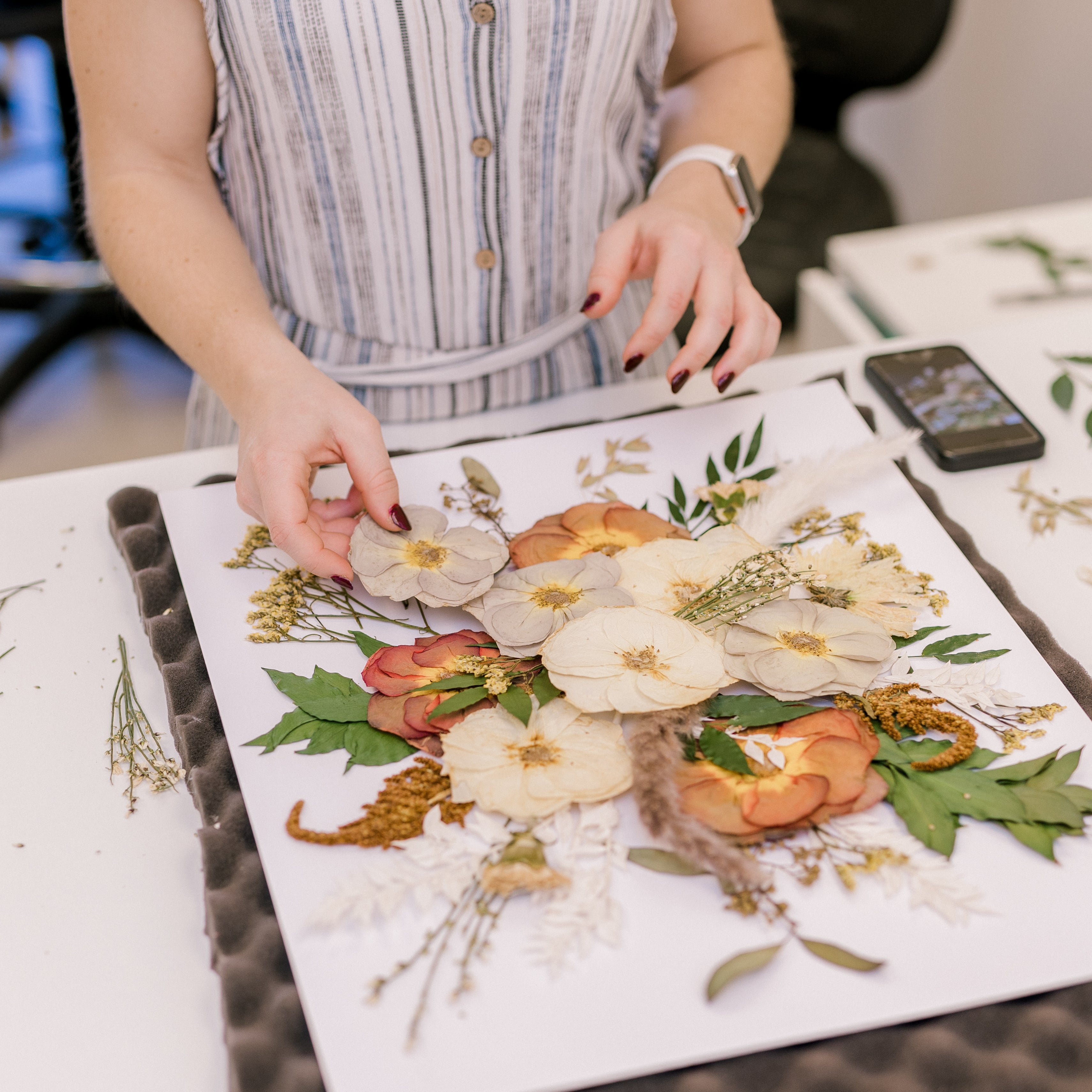Designer creating floral frame