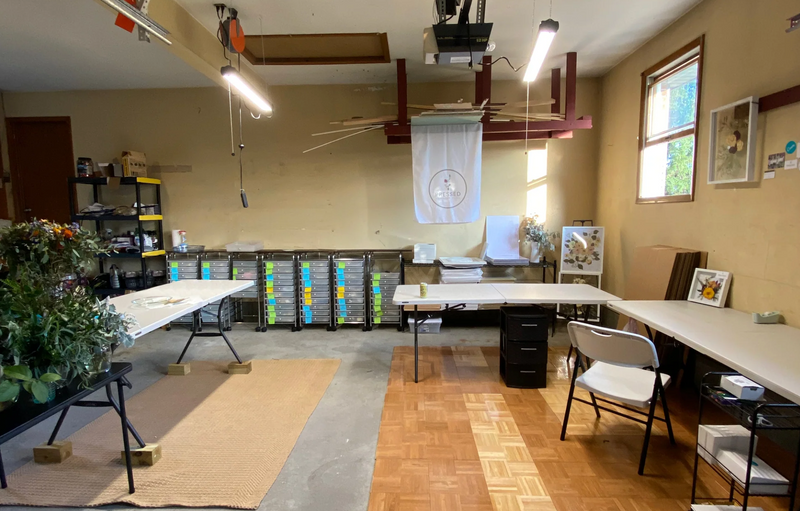 The Pressed Bouquet Shop operating out of a garage filled with flowers