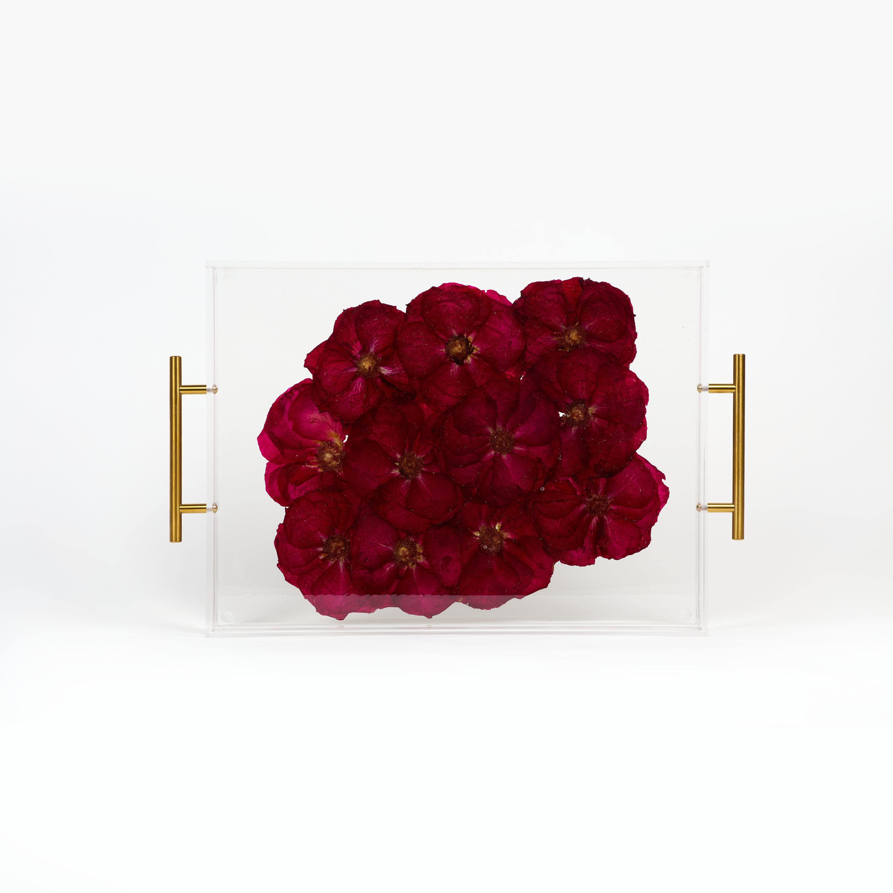 A pressed flower resin serving tray with all red pressed roses. Wedding bouquet preservation as functional home decor.