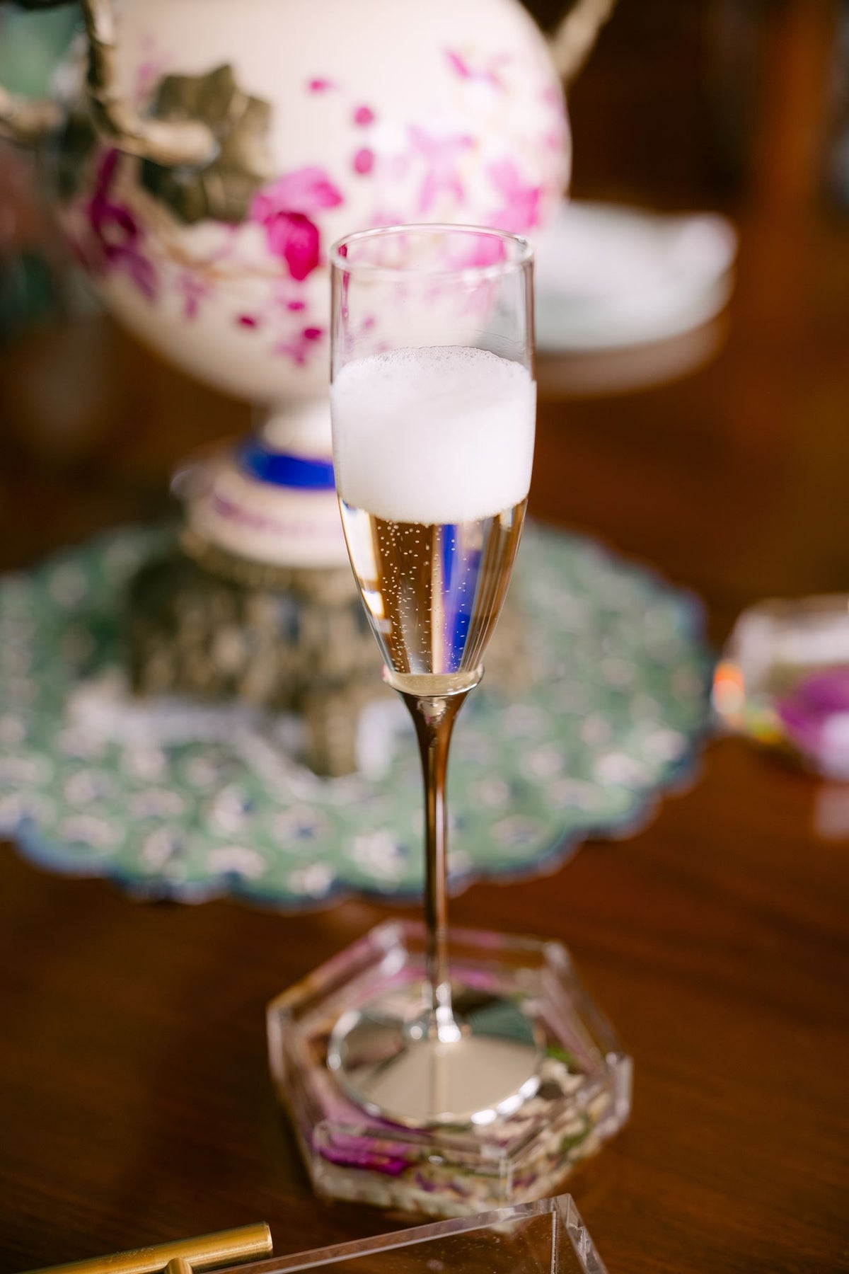 Pair of glass champagne flutes from Element Marketplace, shown filled with champagne