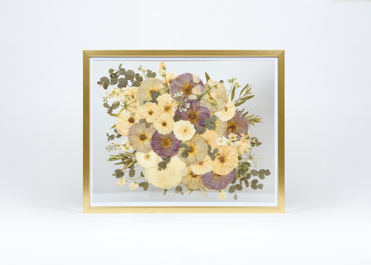 A pressed wedding bouquet featuring quicksand roses
