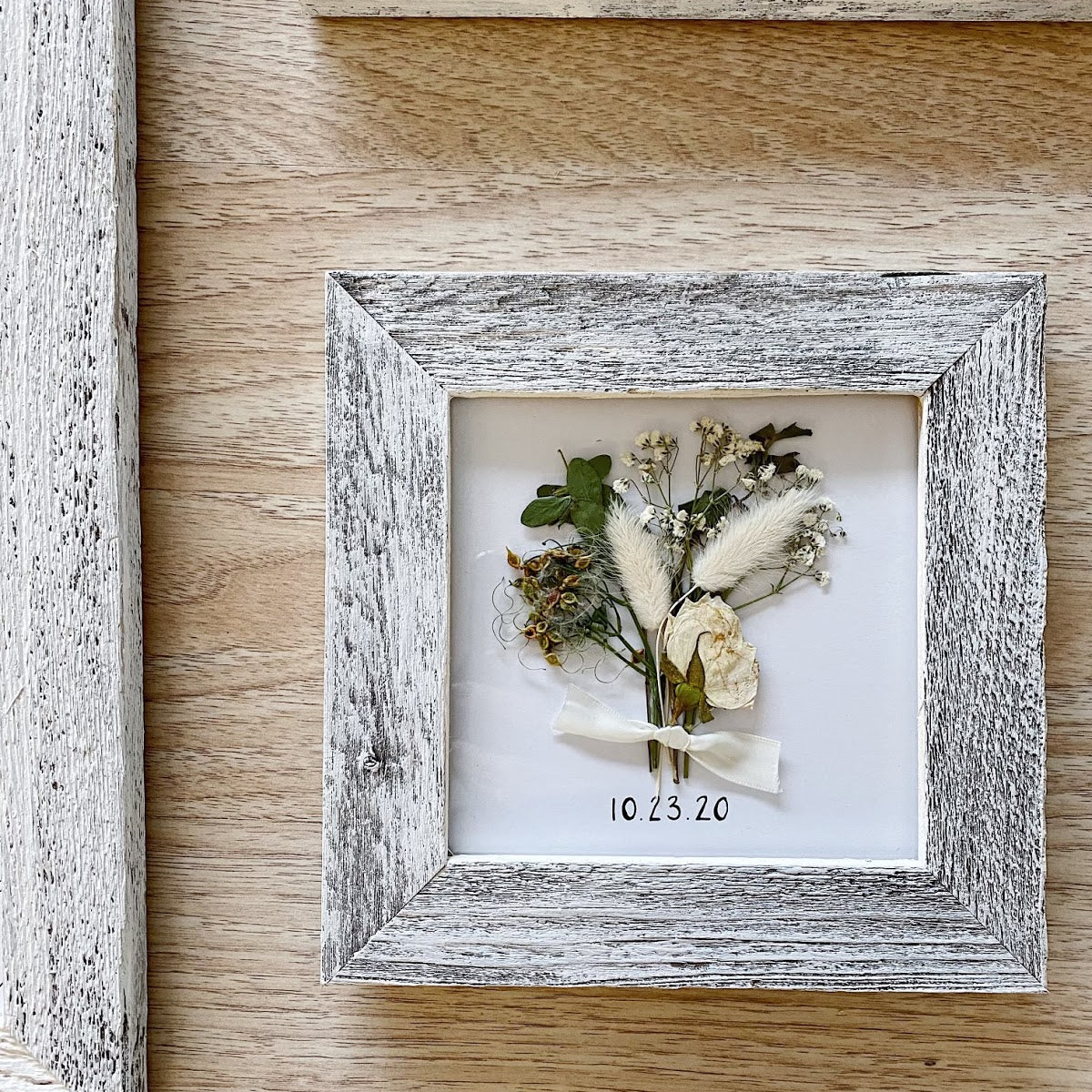 A pressed and framed wedding bouquet gallery.