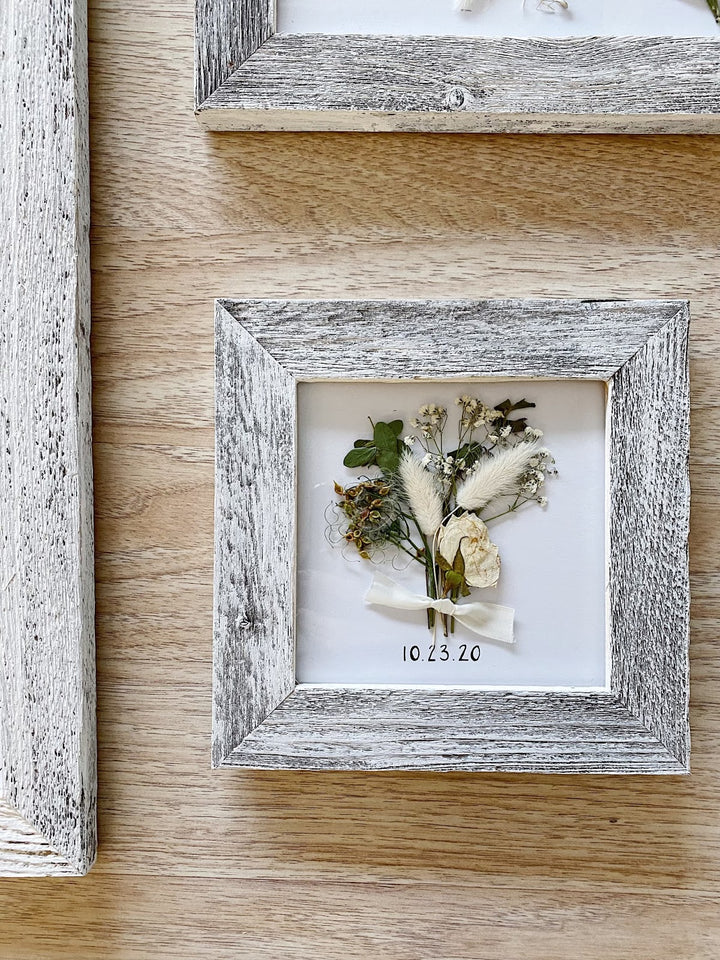 A pressed and framed wedding bouquet gallery.