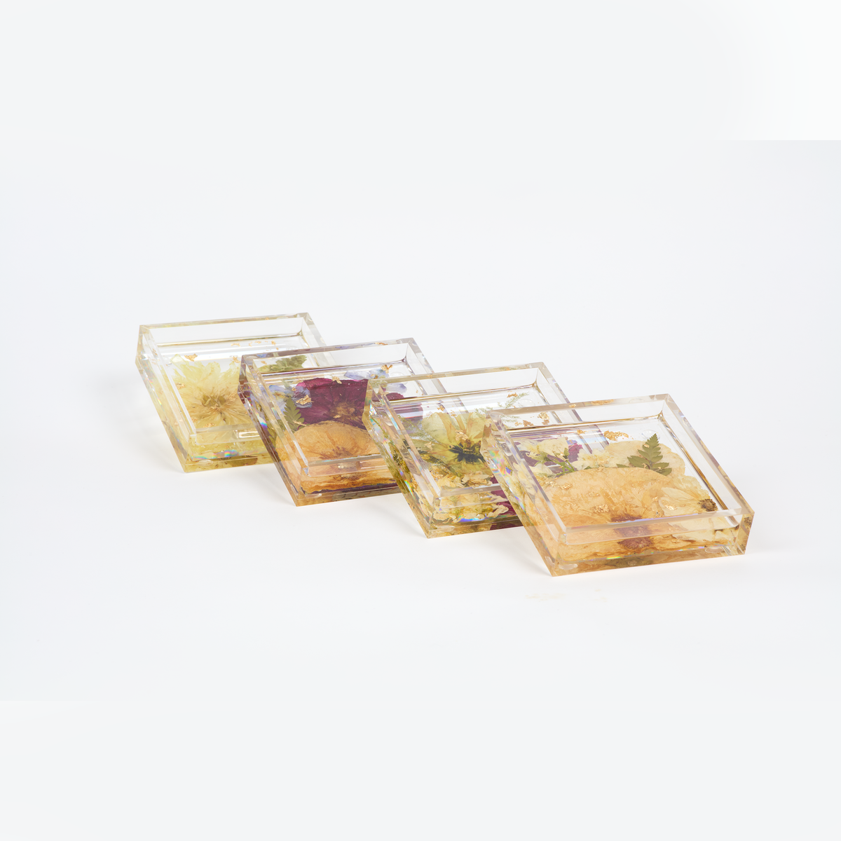 Preserved flowers in resin coasters, a set of four. Square shape. 