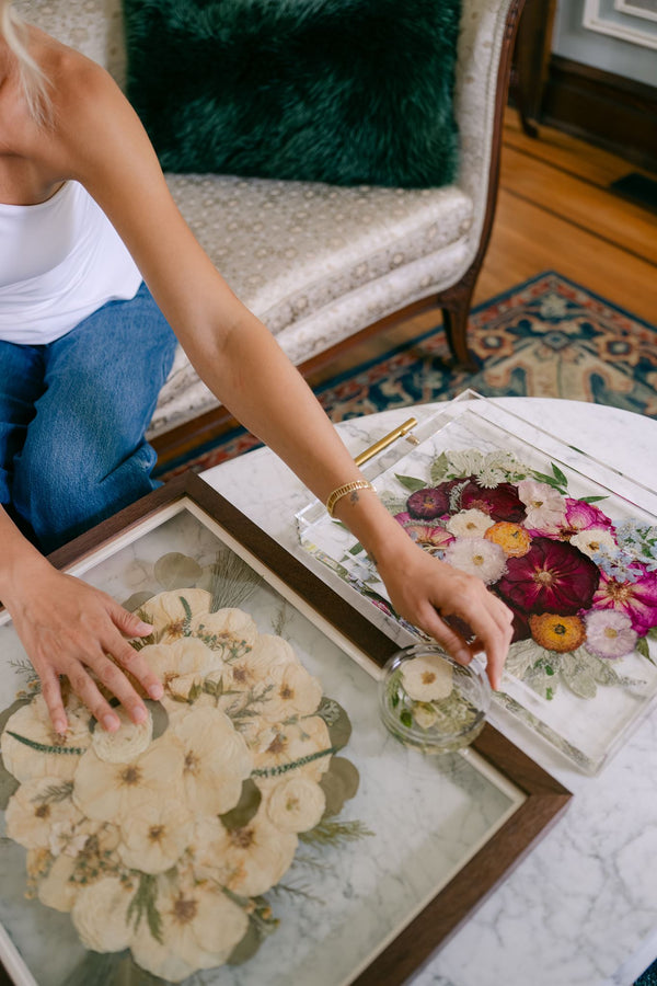 A woman admiring preservation art from her preservation package.