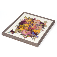 Floral preservation pressed flower frame with purple, pink, and yellow pressed florals and a preserved boutonniere on the bottom corner. 16x20 barn wood frame design. 
