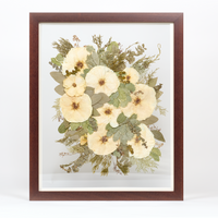 Floral preservation pressed flower frame with white and green pressed florals. 16x20 walnut wood frame bridal bouquet preservation design.