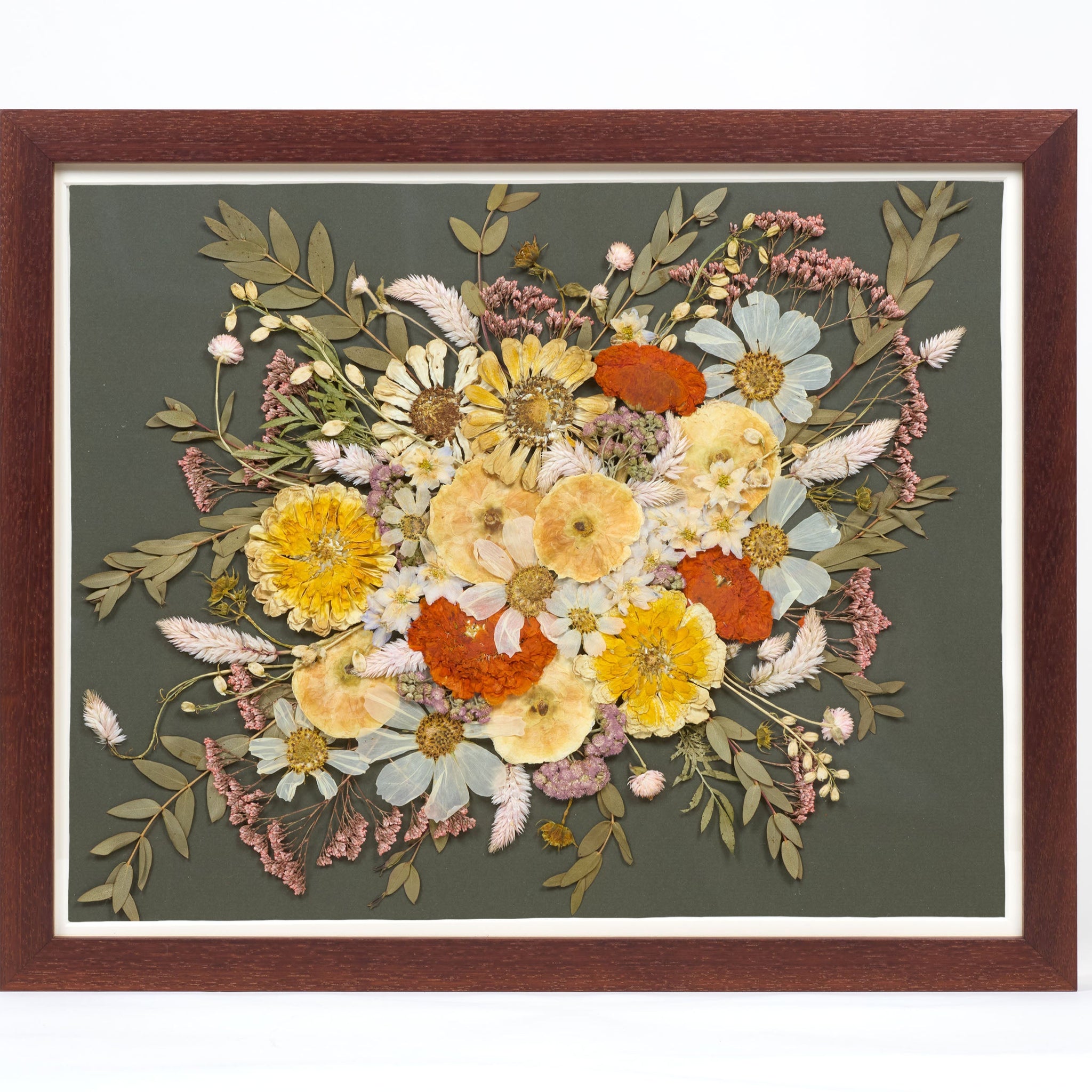 Walnut wood frame with preserved flowers on dark green background