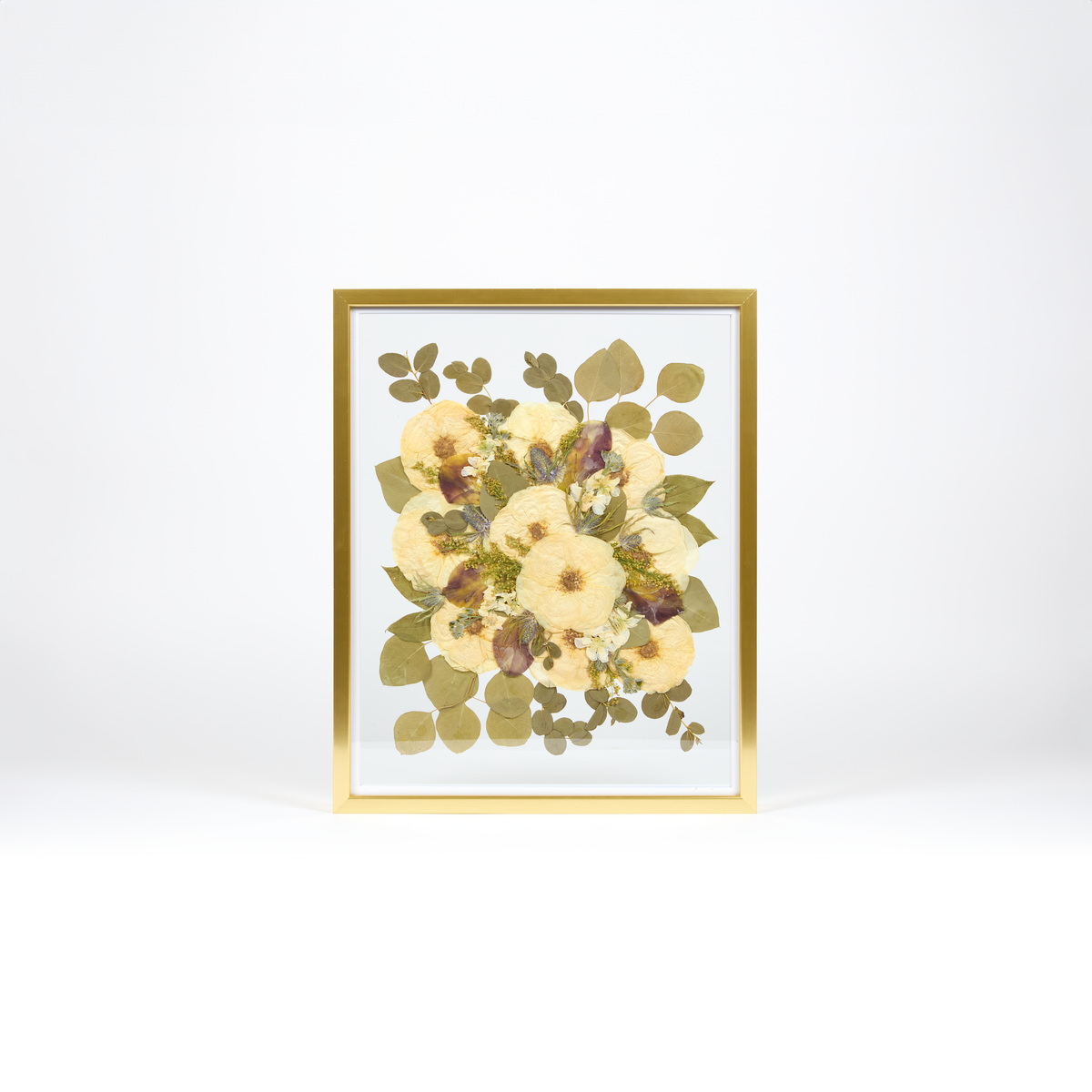 Floral preservation pressed flower frame with white roses, pressed calla lilies, and pressed greenery. 16x20 gold wood pressed bridal bouquet frame design. 