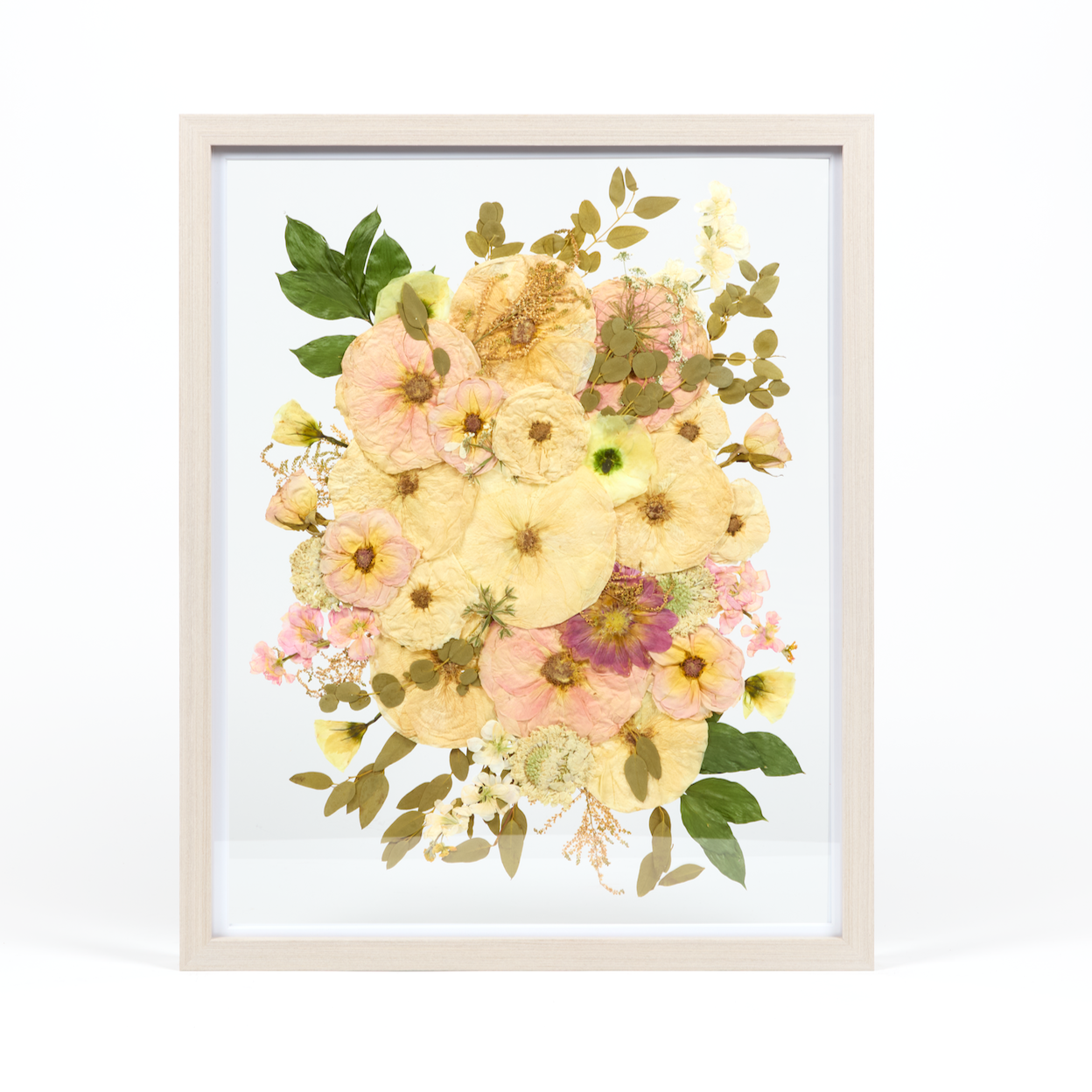 Floral preservation pressed flower frame with pink, white, and green pressed florals. 16x20 gray wood frame bridal bouquet preservation design. 