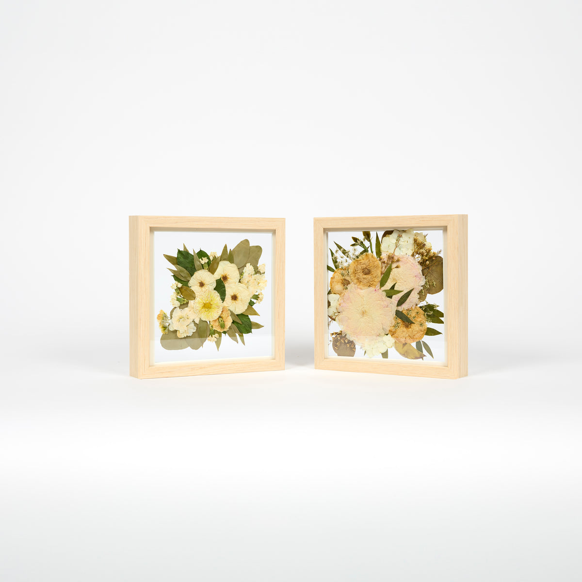Pressed flower wedding preservation with two 10x10 inch frame bundle offering in natural wood. 