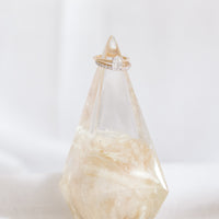Preserved single white rose in resin in the shape of a ring holder from a wedding.