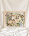 Wedding bouquet pressed and preserved in a floating frame made of natural colored wood. 