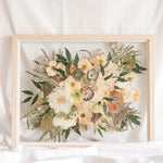 Wedding flowers preserved in time in a floating glass frame made of natural wood. 