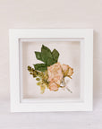 6x6, mini white wood frame with a pressed boutonniere.