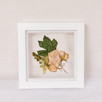 6x6, mini white wood frame with a pressed boutonniere.