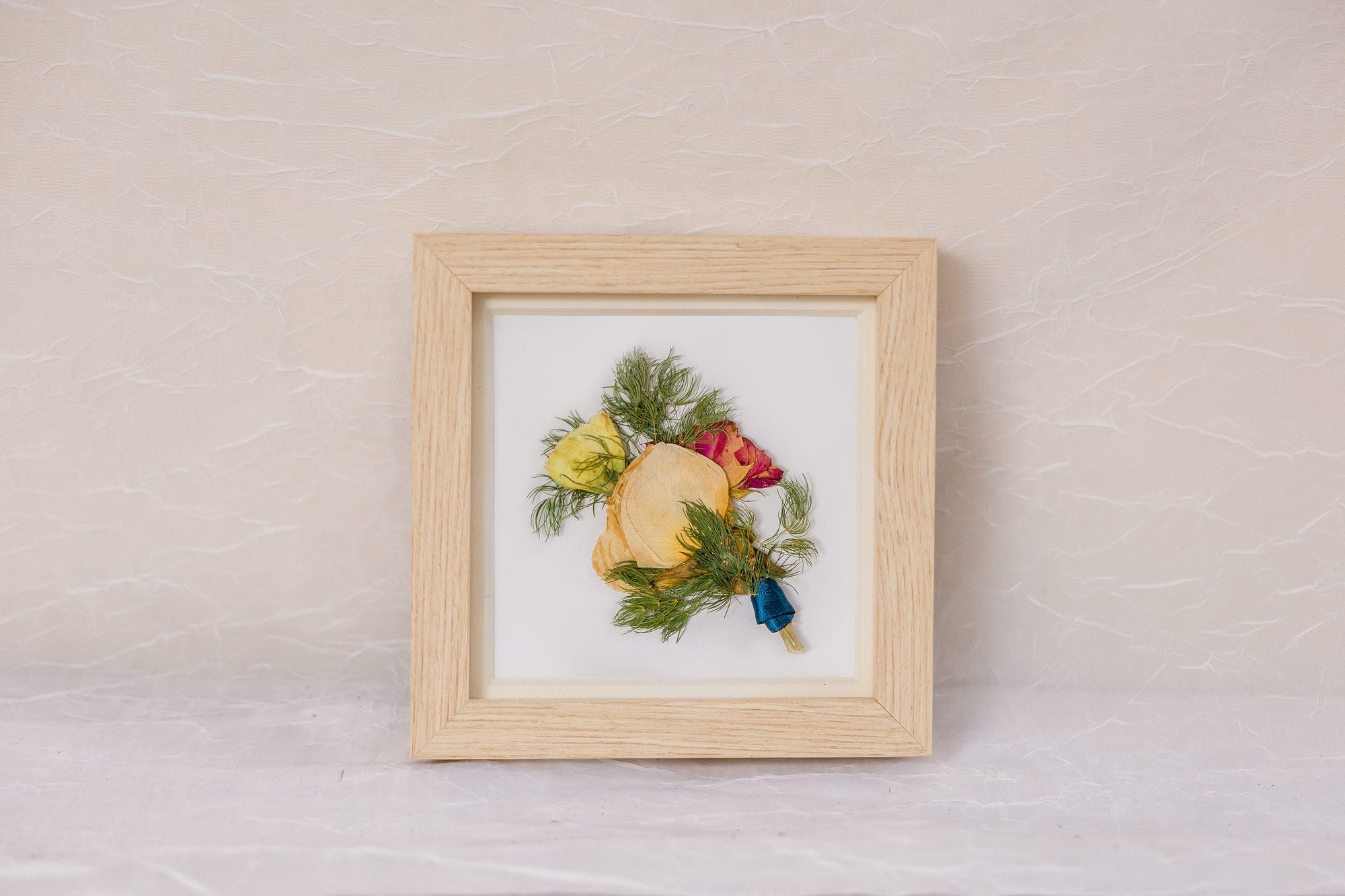 6x6 inch pressed flower natural wood frame with a pressed boutonniere made by Element Design Co