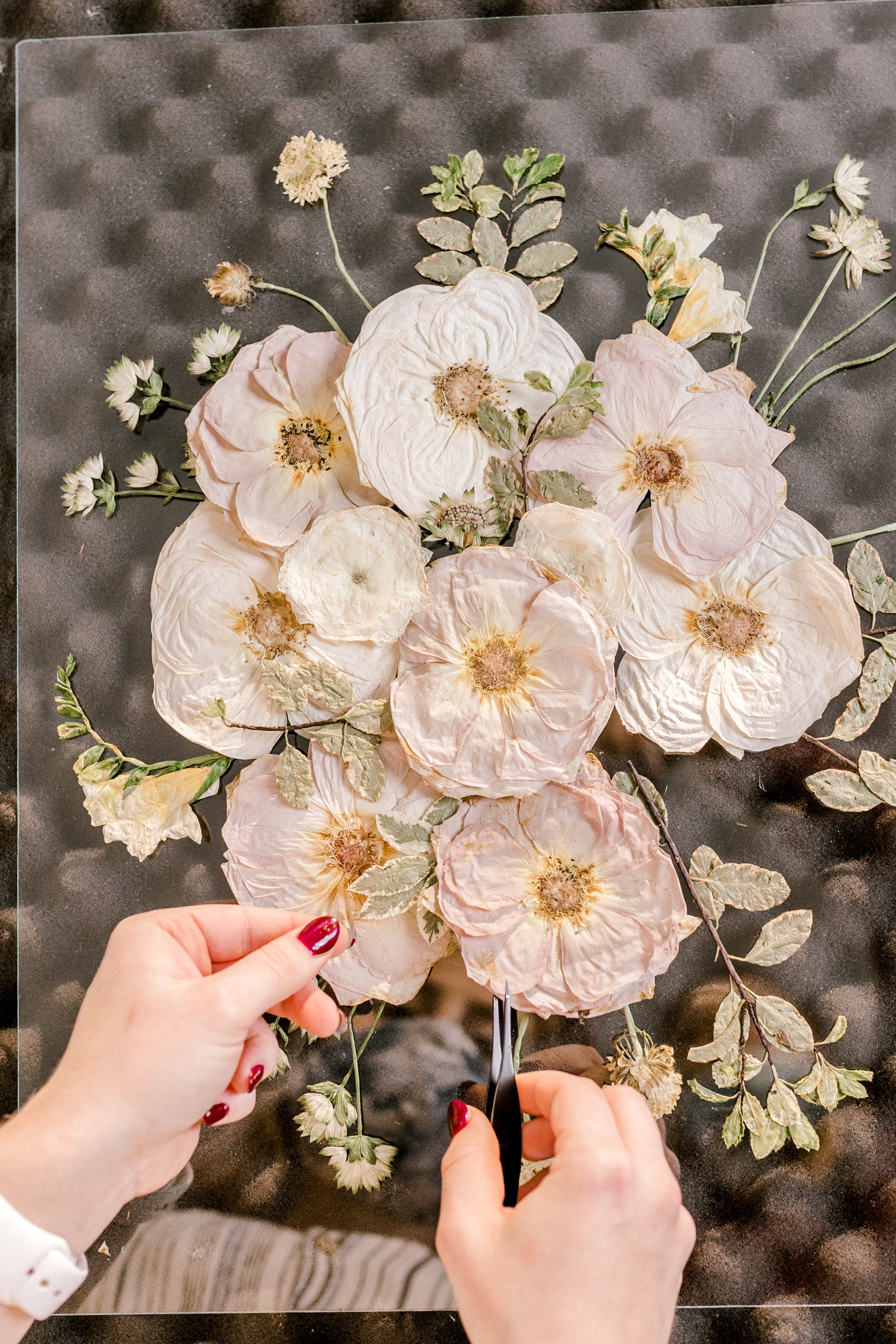 Pressed Designer putting together a pressed flower design