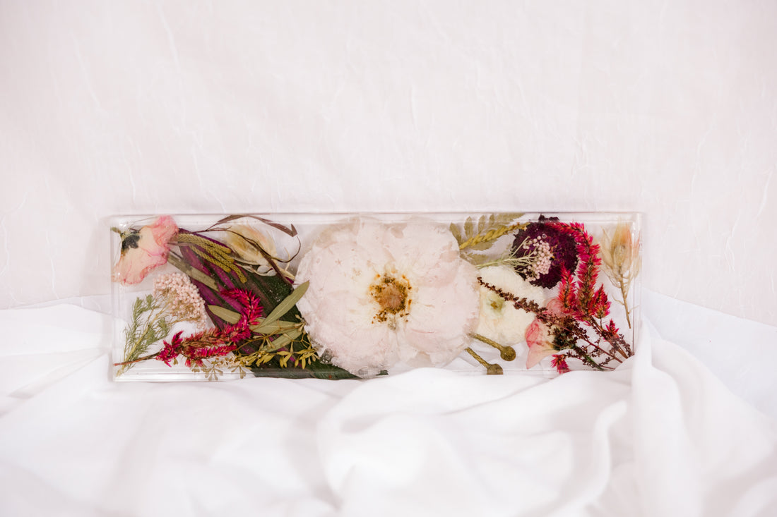 Flowers from a pink and white wedding bouquet preserved as a functional piece of home decor. 