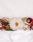 Flowers from a pink and white wedding bouquet preserved as a functional piece of home decor. 