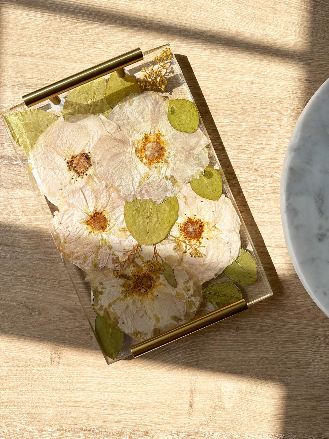 Rectangle resin serving tray with  gold handles.