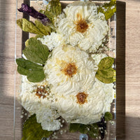 Rectangle resin serving tray with silver handles.