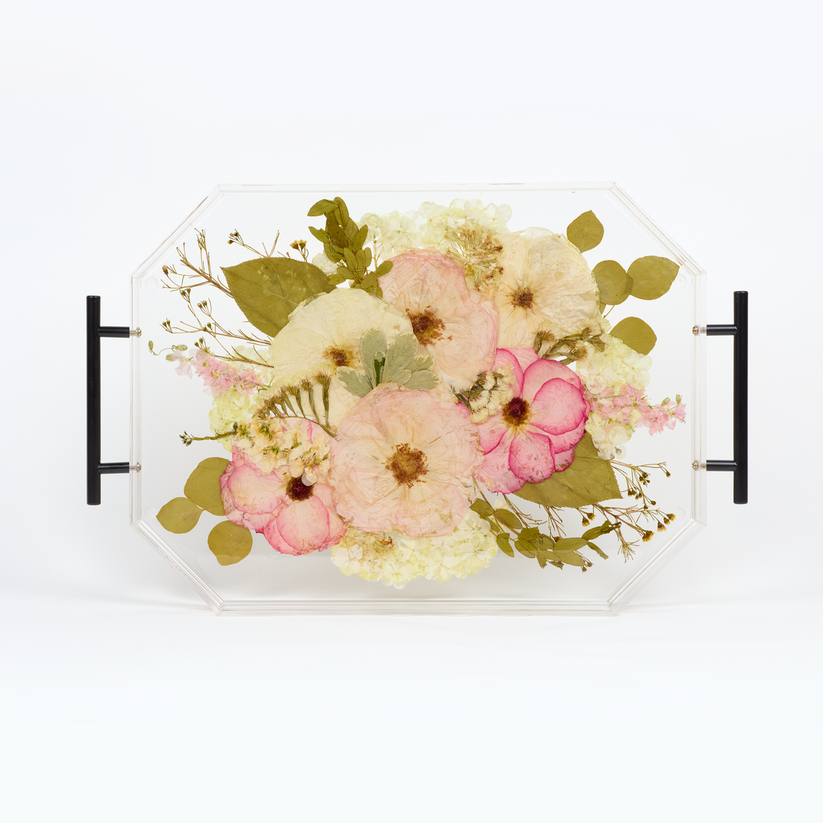 A pressed flower resin serving tray with pink and white pressed florals. Wedding bouquet preservation as functional home decor. 
