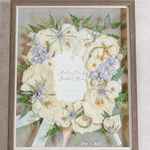 White, green, and blue florals pressed and preserved into a large wooden frame.