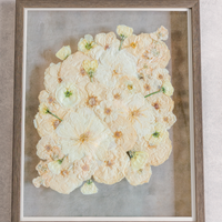 Large barn wood frame with pressed white roses encased.