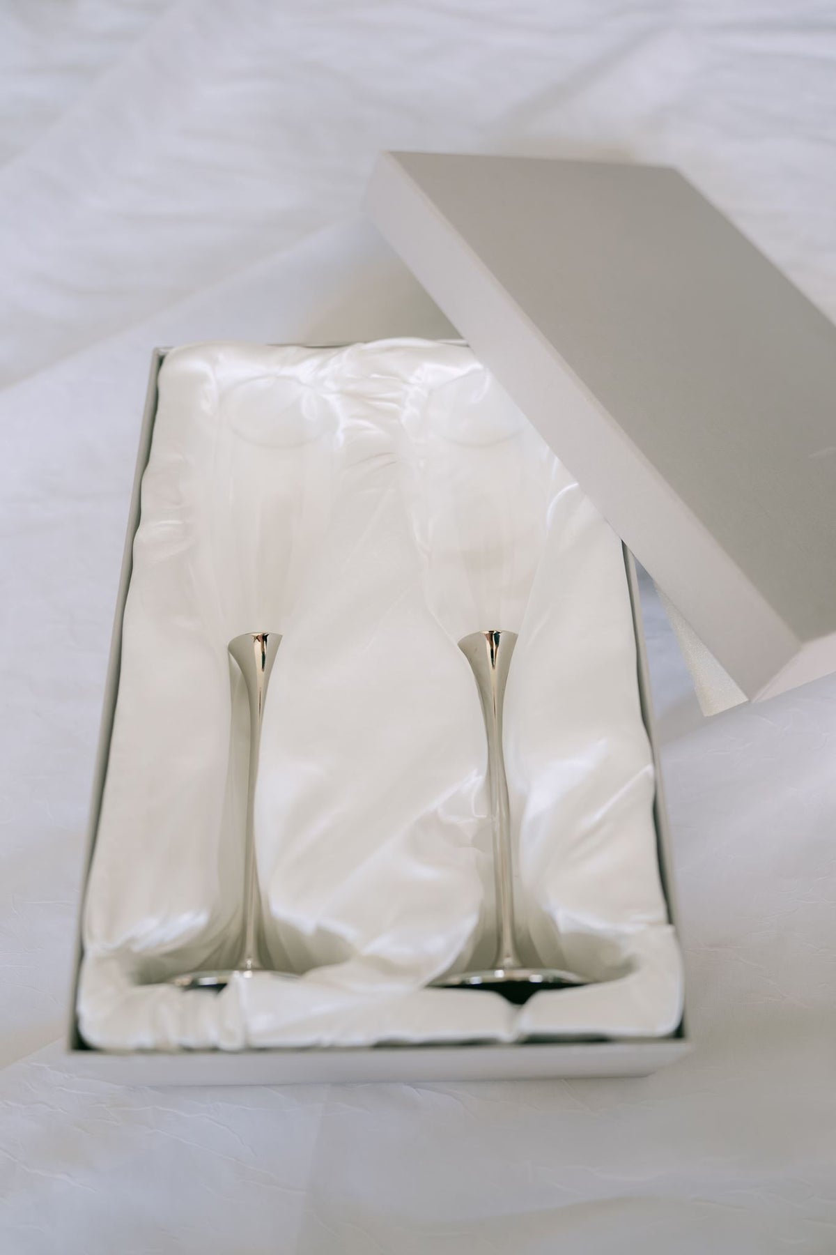 Pair of glass champagne flutes from Element Marketplace, shown in gift box