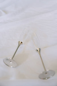 Pair of glass champagne flutes from Element Marketplace, shown side by side