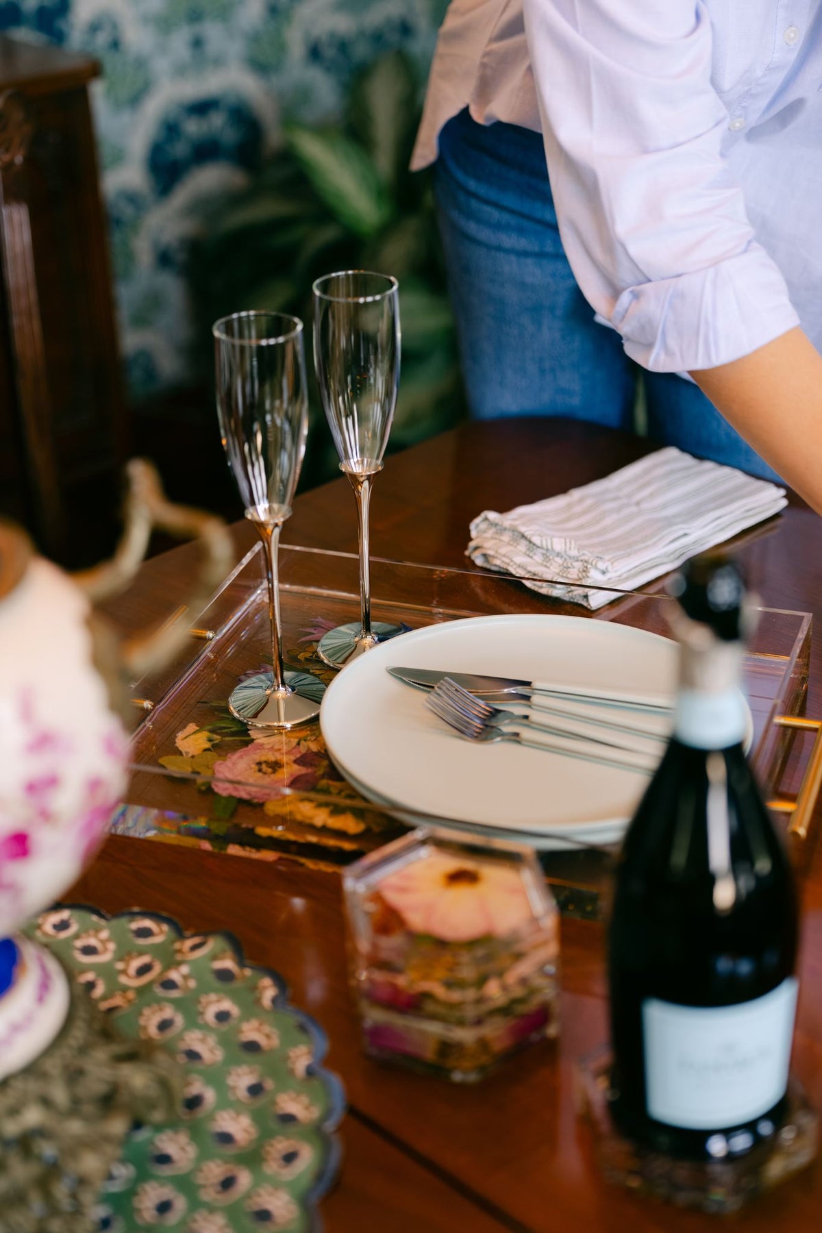Pair of glass champagne flutes from Element Marketplace, shown on a resin serving tray