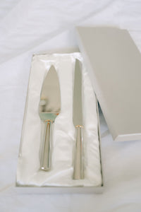 Gold ring handled wedding cake knife and server set from Element Marketplace, shown in gift box