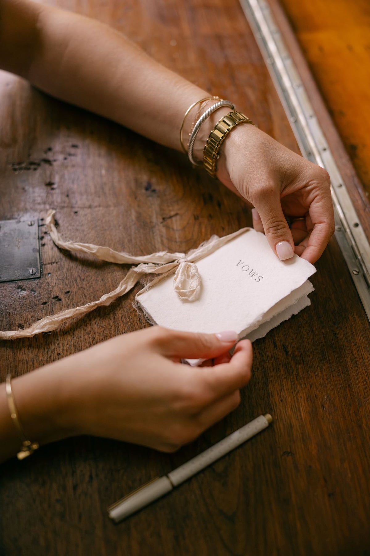Wedding vow book from Element Marketplace, shown in hands, partially opened