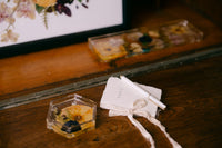 Wedding vow book from Element Marketplace, shown individually next to resin coaster