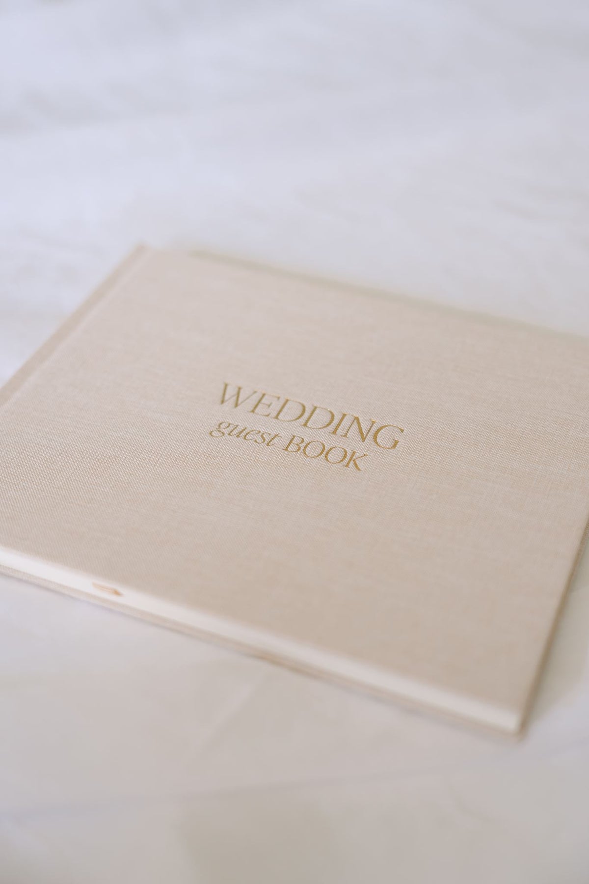 Hardcover wedding guest book in beige from Element Marketplace, shown from the front