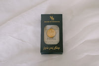 Brass wildflower wax seal stamp from Element Marketplace, shown in packaging