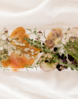 Custom floral resin display tray featuring wildflowers in pink, orange, and green tones. 