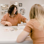 Jenni, Creative Manager, covering the design process for pressed flower designs with client