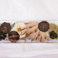 Beautiful big flowers, including a protea, dried and preserved in a resin display tray